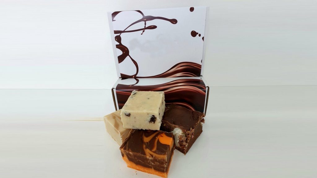 Blocks of fudge infront of a Munchkins box