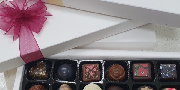 Sweet chocolate box with pink and yellow ribbons